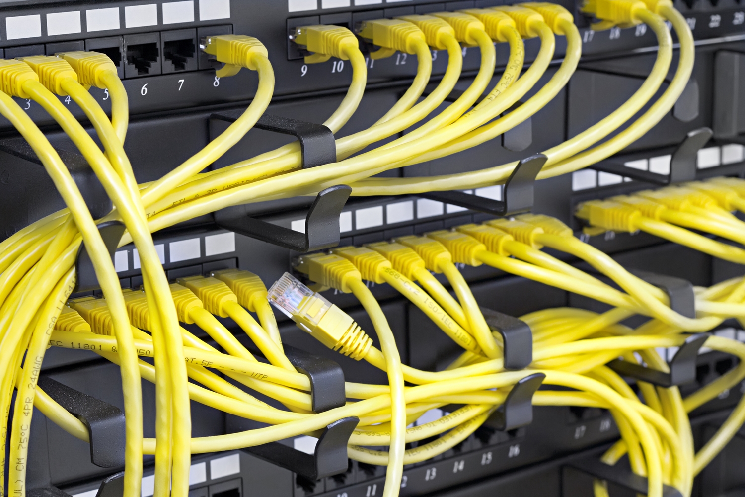 organized data rack cabling with yellow cables
